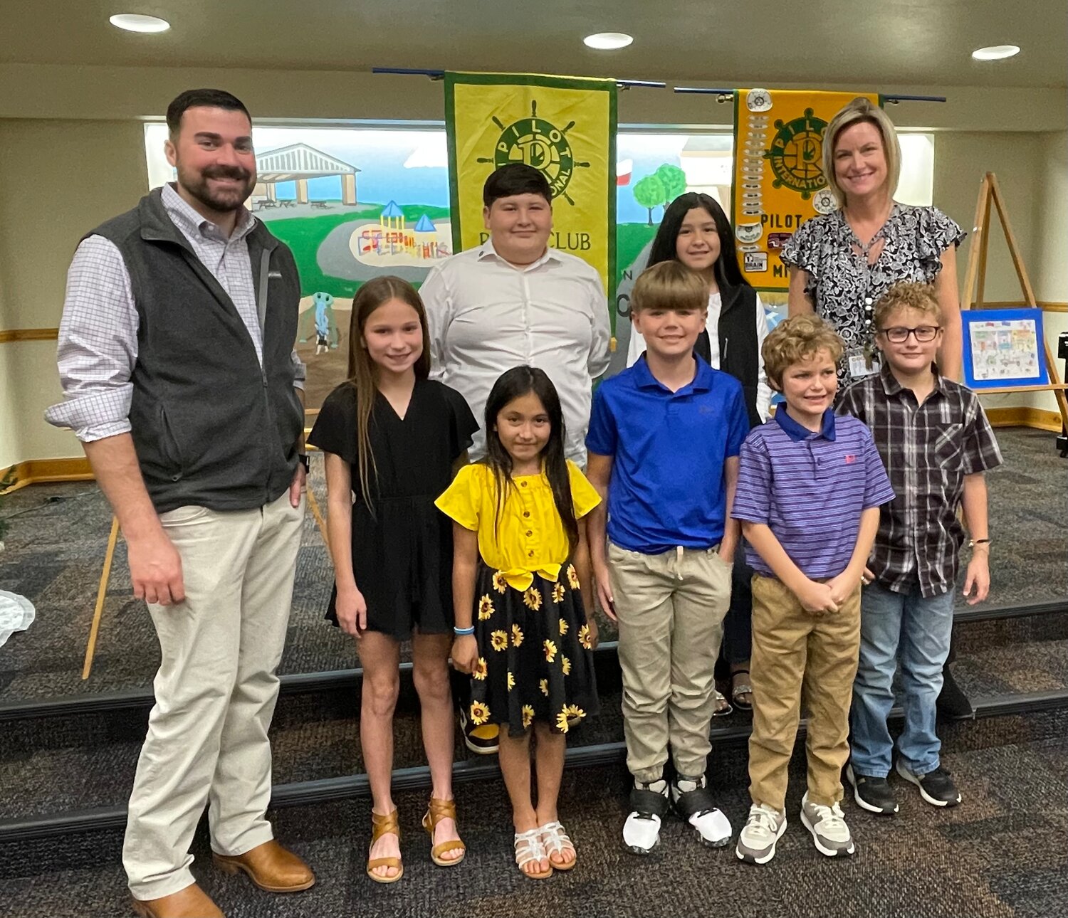 Pictured are, back from left, Assistant Mineola Elementary Principal Nick Kelley, Gio Mata Romero, Kimberly Santos, Principal Angela Shine; and, second row, Macy Lisenbe, Odessi Hernandez, John Moreland and Eason Hooton. (Not pictured are Ronald Good’Iron, Bentley Best and Penelope Barrera.)